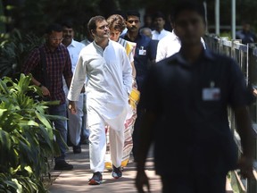 Congress party President Rahul Gandhi arrives for a Congress Working Committee meeting, followed by his sister Priyanka Vadra Gandhi, in New Delhi, India, Saturday, May 25, 2019. The BJP's top rival, led by Gandhi, won 52 seats.