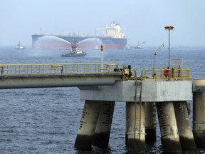 FILE - In this Sept. 21, 2016 file photo, an oil tanker approaches to the new Jetty during the launch of the new $650 million oil facility in Fujairah, United Arab Emirates. The United Arab Emirates said Sunday, May 12, 2019 that four commercial ships near Fujairah "were subjected to sabotage operations" after false reports circulated in Lebanese and Iranian media outlets saying there had been explosions at the Fujairah port.