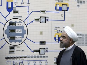 FILE - In this Jan. 13, 2015, file photo released by the Iranian President's Office, President Hassan Rouhani visits the Bushehr nuclear power plant just outside of Bushehr, Iran. Rouhani is reportedly set to announce ways the Islamic Republic will react to continued U.S. pressure after President Donald Trump pulled America from Tehran's nuclear deal with world powers. Iranian media say Rouhani is expected to deliver a nationwide address as soon as Wednesday, May 8, 2019, regarding the steps the country will take.