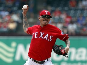 Texas Rangers pitcher Jesse Chavez throws to the Seattle Mariners in the first inning of a baseball game in Arlington, Texas, Wednesday, May 22, 2019.