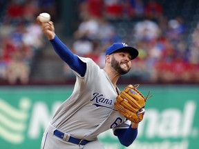 Kansas City Royals starting pitcher Jakob Junis throws to a Texas Rangers batter during the first inning of a baseball game in Arlington, Texas, Thursday, May 30, 2019.