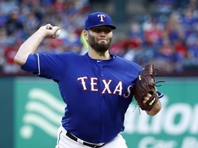 Texas Rangers starting pitcher Lance Lynn throws to a Toronto Blue Jays batter during the first inning of a baseball game in Arlington, Texas, Saturday, May 4, 2019.