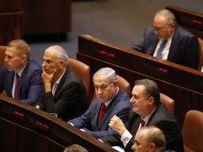Israeli Prime Minister Benjamin Netanyahu before voting in the Knesset, Israel's parliament in Jerusalem, Wednesday, May 29, 2019. Israeli Prime Minister Benjamin Netanyahu faced a deadline at midnight Wednesday to form a new governing coalition as he tried to stave off a crisis that could trigger an unprecedented second election this year or even force the longtime leader to step down.