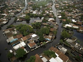 The Santa Ana neighborhood is flooded in Asuncion, Paraguay, Tuesday, May 7, 2019. Officials say they've had to evacuate some 40,000 people due to unusually heavy rains since March.