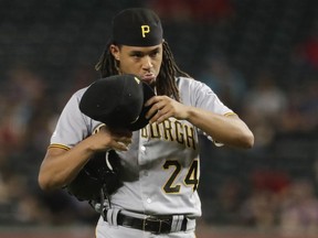 Pittsburgh Pirates starting pitcher Chris Archer walks off the mound after giving up tree run against the Arizona Diamondbacks during the top of the first inning of a baseball game in Phoenix, Wednesday, May 15, 2019.