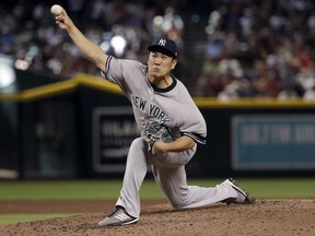 New York Yankees starting pitcher Masahiro Tanaka throws against the Arizona Diamondbacks during the fourth inning of a baseball game, Wednesday, May 1, 2019, in Phoenix.