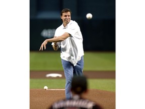 Arizona Diamondbacks Hall of Fame pitcher Randy Johnson throws out the first pitch prior to a baseball game between the Diamondbacks and San Francisco Giants on Saturday, May 18, 2019, in Phoenix. The Diamondbacks were marking the 15th anniversary of Johnson's perfect game against the Atlanta Braves.