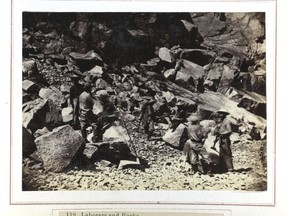 In this photo made between 1862 and 1869, railroad workers, including some Chinese laborers, are seen near an opening of the Summit Tunnel of the Central Pacific Railroad in Northern California. Members of the Chinese Railroad Workers Descendants Association are gathering in Utah in May 2019 to commemorate the 150th anniversary of the railroad's completion.