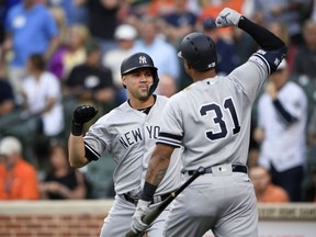 New York Yankees' Gary Sanchez, left, celebrates his three-run home run with Aaron Hicks (31) during the first inning of the team's baseball game against the Baltimore Orioles, Tuesday, May 21, 2019, in Baltimore.