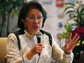 FILE - In this Aug. 27, 2016, file photo, Philippine Ombudsman Conchita Carpio-Morales, one of the Ramon Magsaysay awardees for this year, stresses a point during a news conference in Manila, Philippines. Carpio- Morales, who accused Chinese President Xi Jinping of crimes against humanity before the International Criminal Court, says she has been barred for hours from entering Hong Kong for unspecified reasons.
