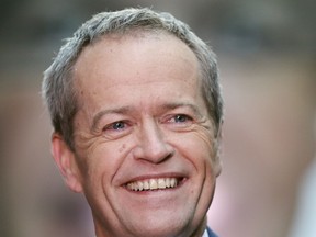 FILE - In this July 2, 2016, file photo, Australian Labor Party leader Bill Shorten speaks to supporters on a street after a breakfast show television interview on election day in Sydney. Shorten, the man most likely to become Australia's prime minister in elections on Saturday, May 18, 2019 has the support of his center-left Labor Party.