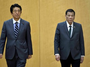 Japan's Prime Minister Shinzo Abe, left, and Philippines President Rodrigo Duterte attend a welcoming prior to their meeting at Abe's official residence Friday, May 31, 2019, in Tokyo. Duterte is in Japan to participate in the 25th International Conference on the Future of Asia in Tokyo.