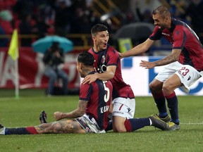 Bologna's Erick Pulgar, left, celebrates with his teammates after scoring his side's second goal during the Serie A soccer match between Bologna and Parma at the Renato Dall'Ara stadium in Bologna, Italy, Monday, May 13, 2019.