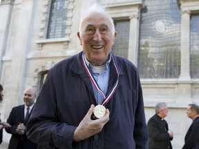 The late Jean Vanier, the Canadian-born founder of L'Arche communities, poses for a photograph after receiving the Templeton Prize at St Martins-in-the-Fields church in London, England, on May 18, 2018.