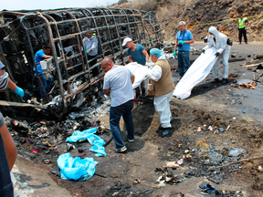 Rescue personnel recover bodies at the scene of a crash between a bus carrying Catholic pilgrims and a semi-trailer on a mountain road in Veracruz, Mexico on May 29, 2019.