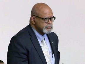 In this Tuesday, May 14, 2019 still image from video, Dr. Michael Watkins, a vascular surgeon at Massachusetts General Hospital, stands during arraignment in Boston on charges of driving drunk, striking three pedestrians in a crosswalk and then leaving the scene. (WBZ-TV via AP, Pool)