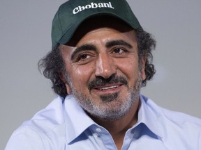 FILE - In this Jan. 16, 2018 file photo, Hamdi Ulukaya, founder, chairman and CEO of Chobani, speaks at the National Retail Federation conference in New York. Ulukaya tweeted on Thursday, May 9, 2019, that his company will pay some of the school lunch debt for students in the Warwick, R.I., public school district. Schools there had offered students who owe money for lunches cold sunflower butter and jelly sandwiches instead of a hot meal. The mayor's office said it is coordinating with Chobani to accept nearly $50,000 owed for lunches by low-income families with children in the school system.