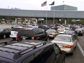FILE - In this Aug. 4, 2005 file photo, traffic traveling from Niagara Falls, Ontario, Canada, lines up on the Rainbow Bridge to enter the United States through a border checkpoint at Niagara Falls, N.Y. Some along the northern U.S. border are worried the temporary transfer of hundreds of border agents south could cause backups of those seeking to enter the United States from Canada during the busy 2019 summer tourist season.