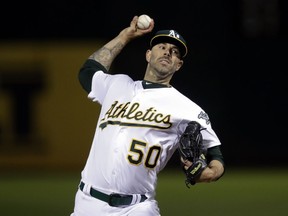 Oakland Athletics pitcher Mike Fiers works against the Cincinnati Reds during the first inning of a baseball game Tuesday, May 7, 2019, in Oakland, Calif.