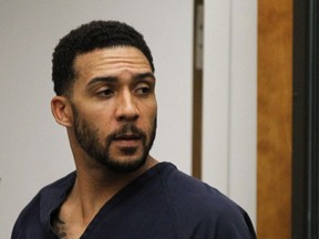 FILE - In this June 15, 2018, file photo, former NFL football player Kellen Winslow Jr., center, leaves his arraignment in Vista, Calif. Winslow, a former NFL No. 1 draft pick and son of a Hall of Famer who starred for his hometown San Diego Chargers, goes on trial Monday, May 20, 2019, on multiple charges including raping two women last year and raping an unconscious 17-year-old girl. He has pleaded not guilty to all charges.