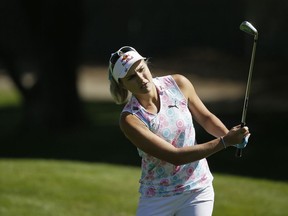 Lexi Thompson follows her shot from off the 18th fairway of the Lake Merced Golf Club during the first round of the LPGA Mediheal Championship golf tournament Thursday, May 2, 2019, in Daly City, Calif.