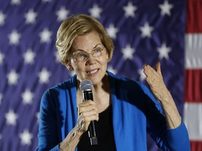 FILE - In this Friday, May 3, 2019 file photo, 2020 Democratic presidential candidate Sen. Elizabeth Warren speaks to local residents during an organizing event, in Ames, Iowa. Warren is bringing her plan to tax the wealthiest U.S. households as a way of fighting the nation's opioid addiction crisis to some of the places hit hardest by the influx of prescription pills. She plans to deliver her message Friday, May 10, to the small West Virginia town of Kermit, and also has stops planned later Friday in Chillicothe and Columbus, Ohio.