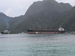 The North Korean cargo ship, Wise Honest, middle, was towed into the Port of Pago Pago in the late morning on Saturday, May 11, 2019, in Pago Pago, American Samoa. The Wise Honest ship was seized by the U.S. because of suspicion it was used to violate international sanctions. It arrived Saturday at the capital of this American territory.