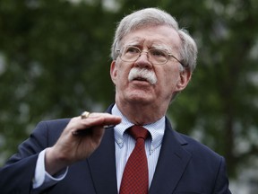 FILE - In this Wednesday, May 1, 2019 file photo, National Security Adviser John Bolton talks to reporters about Venezuela, outside the White House, in Washington. Bolton is scheduled to deliver the keynote address Wednesday, May 22, 2019, at the United States Coast Guard Academy graduation ceremony. Bolton has been President Donald Trump's national security adviser since April of last year.