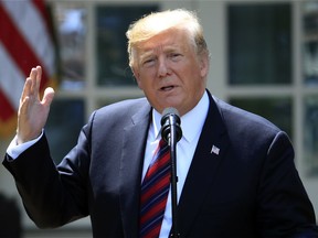 FILE - In this May 16, 2019, file photo, President Donald Trump speaks in the Rose Garden of the White House in Washington. A judge is poised to hear oral arguments Wednesday, May 22, 2019, over Trump's effort to block congressional subpoenas seeking financial records from two banks. The hearing occurs after congressional Democrats sought the information from Deutsche Bank and Capital One.