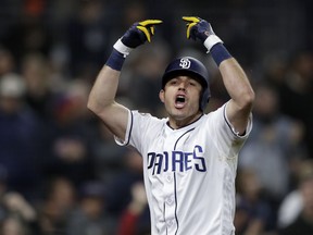 San Diego Padres' Ian Kinsler celebrates after hitting a three-run home run during the sixth inning of the team's baseball game against the Pittsburgh Pirates, Thursday, May 16, 2019, in San Diego.