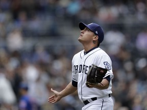 San Diego Padres relief pitcher Gerardo Reyes reacts after striking out New York Mets' Todd Frazier during the seventh inning of a baseball game Wednesday, May 8, 2019, in San Diego.