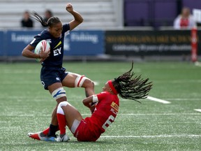 Canada's Charity Williams grabs hold of U.S. player Kristen Thomas during quarter-final action in the HSBC World Rugby Women's Sevens Series at Westhills Stadium in Langford, B.C., on Sunday, May 12, 2019. The U.S. won 12-7.