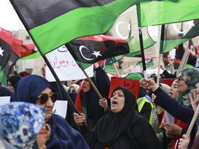 Libyans hold a demonstration at Martyrs' Square against military operations by forces loyal to Field Marshal Khalifa Hifter in Tripoli, Libya, Friday, May 3, 2019.