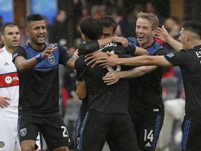San Jose Earthquakes forward Chris Wondolowski, center back, is congratulated by teammates after scoring a goal against the Chicago Fire during the first half of an MLS soccer match in San Jose, Calif., Saturday, May 18, 2019.