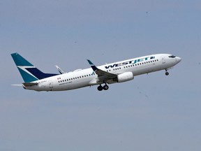 A WestJet 737-800 aircraft takes off from Calgary International Airport on Monday May 13, 2019.