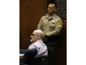 Michael Gargiulo, left, listens to the testimony of Austin Kutcher during Gargiulo's murder trial at Los Angeles Superior Court, Wednesday, May 29, 2019. Gargiulo, 43, has pleaded not guilty to two counts of murder and an attempted-murder charge stemming from attacks in the Los Angeles area between 2001 and 2008, including the death of Kutcher's former girlfriend, 22-year-old Ashley Ellerin.