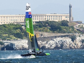 Australia's SailGP team passes Alcatraz while practicing on Tuesday, April 30, 2019, in San Francisco. The F50 foiling catamarans, which organizers say can reach 60 miles per hour, will compete on the San Francisco Bay May 4-5.