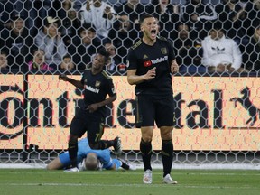 Los Angeles FC forward Christian Ramirez (21) reacts after missing on scoring chance against the Montreal Impact during the first half of an MLS soccer match in Los Angeles, Friday, May 24, 2019.