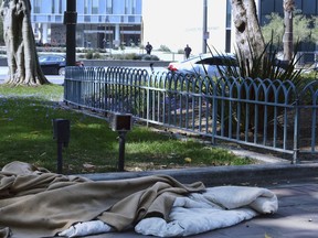 An abandoned sleeping bag and blanket is left in on the grounds of Los Angeles City Hall across the street from Los Angeles Police Department headquarters on Thursday, May 30, 2019. The union that represents the LAPD is demanding a cleanup of homeless encampments in the city after one detective who works downtown was diagnosed with typhoid fever and two others are showing similar symptoms.