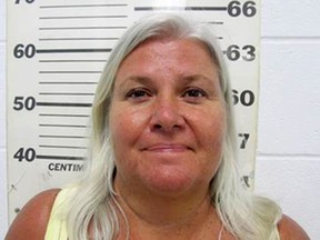 FILE - In this undated file photo provided by the South Padre Island, Texas, Police Department shows Lois Riess, of Blooming Prairie, Minn. A grand jury in Minnesota indicted the 57-year-old woman who authorities allege fatally shot her husband before fleeing to Florida and killing a woman there. Riess led authorities on a cross-country manhunt before she was captured in Texas on April 19, 2018, at a South Padre Island waterfront restaurant by two federal deputy marshals. (South Padre Island Police Department via AP, File)