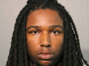 This undated photo provided by the Chicago Police Department shows Eric Adams. Adams and Michael Washington have been charged with with first-degree murder in the Chicago shooting death of a woman who was shielding her 1-year-old daughter from their gunfire. Authorities say Washington and Adams are due in court Thursday, May 30, 2019. They are both from Urbana, Ill. The men are charged in the Tuesday morning fatal shooting of 24-year-old Brittany Hill. Police believe they were targeting three people near Hill in a gang-related conflict. (Chicago Police Department via AP)