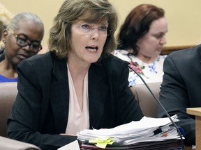 FILE - In this June 14, 2018 file photo, Arkansas Department of Correction Director Wendy Kelley testifies before legislators at the state Capitol in Little Rock, Ark. A federal trial over Arkansas' use of a sedative in lethal injections is wrapping up in Little Rock following testimony from the state's prisons director. Kelley testified Wednesday, May 1, 2019, about her role overseeing four executions that occurred over a two-week span in 2017.