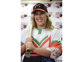 First baseman and member of the National Women's Baseball Team, Diamilette Quiles Alicea, is presented as the first female player to sign with The Utuado Highlanders, one of the teams that participate in the Superior Double A Baseball League, in San Juan, Puerto Rico, Thursday, May 16, 2019. For the first time in Puerto Rico's history, a woman is set to play in an otherwise all-male baseball tournament organized by a popular semi-pro league.
