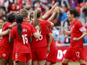 Team Canada captain Christine Sinclair (12) celebrates a goal by midfielder Jessie Fleming (17) during the first half of a women's international soccer friendly against Mexico at BMO field in Toronto, Saturday, May 18, 2019.