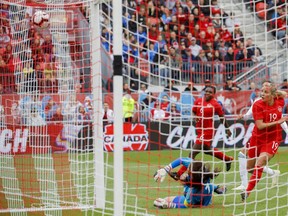 Team Canada's forward Adriana Leon (19) watches her ball hit the back of the net against Team Mexico's goaltender Cecilia Santiago (1) during the second half of a women's international soccer friendly at BMO field in Toronto, Saturday, May 18, 2019.