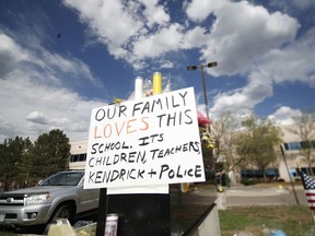 Display grows outside the STEM School Highlands Ranch a week after the attack on the school that left one student dead and others injured Tuesday, May 14, 2019, in Highlands Ranch, Colo.