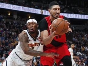 Denver Nuggets forward Torrey Craig, left, runs into Portland Trail Blazers center Enes Kanter, who pulls in a rebound during the first half of Game 2 of an NBA basketball second-round playoff series Wednesday, May 1, 2019, in Denver.