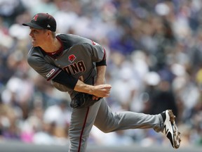 Arizona Diamondbacks starting pitcher Zack Greinke works against the Colorado Rockies in the first inning of a baseball game Monday, May 27, 2019, in Denver.