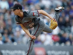 Arizona Diamondbacks starting pitcher Luke Weaver works against the Colorado Rockies in the first inning of a baseball game Saturday, May 4, 2019, in Denver.