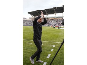 Colorado Rapids coach Conor Casey claps to fans during the first half of the team's MLS soccer match against the Vancouver Whitecaps on Friday, May 3, 2019, in Commerce City, Colo.